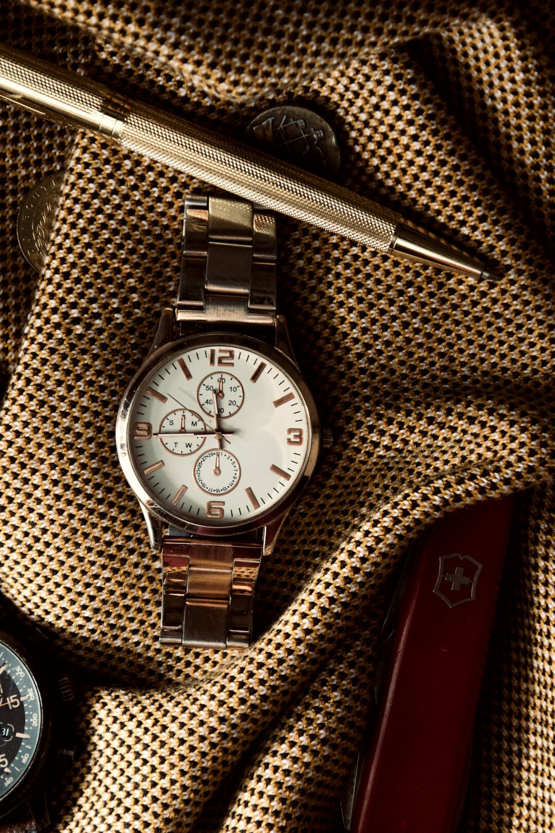Watchmaker's hands assembling a Swiss watch movement with fine tools